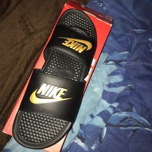 gold nike slides .